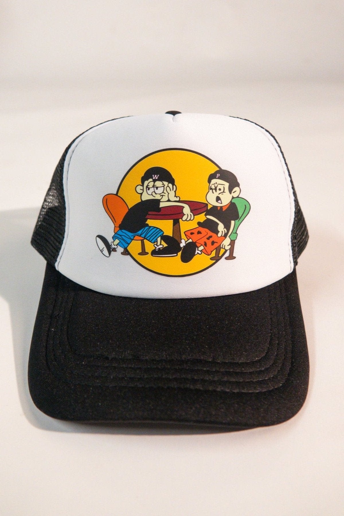 Black and white PWee trucker hat with a cartoon graphic of two friends